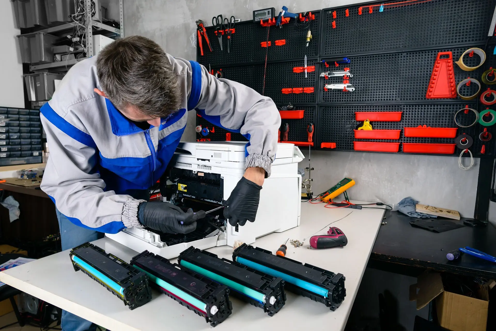 Deltron technician refurbishing toner cartridges
